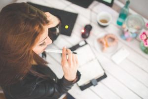 woman-hand-desk-office-min-1024x683